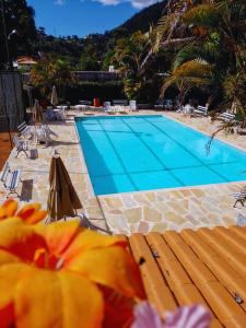 The swimming pool at or close to Pousada Sitio Sossego