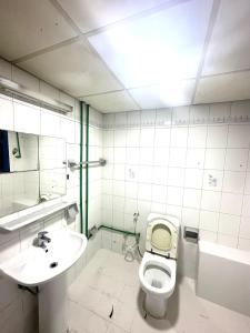 a bathroom with a toilet and a sink at Low Priced New Residential Rooms for rent in Dubai near DAFZA Metro Station in Dubai