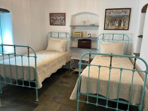 A bed or beds in a room at Galatea House Katoï with patio