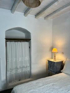 A bed or beds in a room at Galatea House Katoï with patio