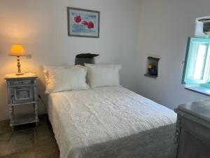 A bed or beds in a room at Galatea House Katoï with patio