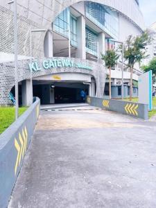 a building with a tunnel in front of it at [PROMO]Connected train 2 Bedroom (ABOVE MALL)15 in Kuala Lumpur