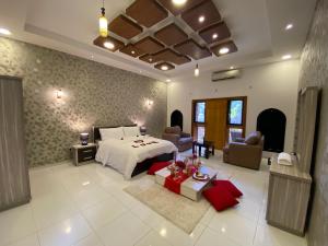 a large bedroom with a bed and a living room at Aryaf hostel in Nizwa