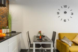 Kuchnia lub aneks kuchenny w obiekcie Lumina cozy apartments Manufaktura