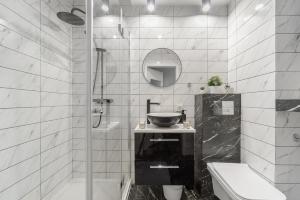 Łazienka w obiekcie Lumina cozy apartments Manufaktura