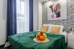 Łóżko lub łóżka w pokoju w obiekcie Lumina cozy apartments Manufaktura