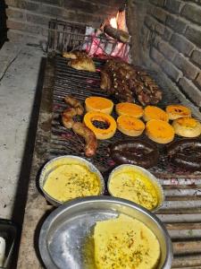 a grill with a bunch of food on it at el descanso in San Antonio de Areco +5 photos