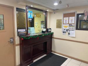 a fast food restaurant with a christmasreath on the door at Circle Motor Lodge in South Amboy