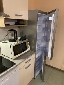Kuchyň nebo kuchyňský kout v ubytování Déli Terasz B Apartman Free parking, self-check-in anytime