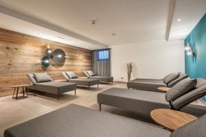 a waiting room with couches and tables in a building at Miramonte in Sölden