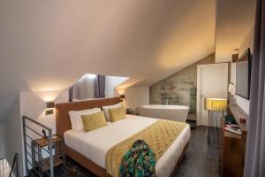 Postel nebo postele na pokoji v ubytování Navona Essence Hotel