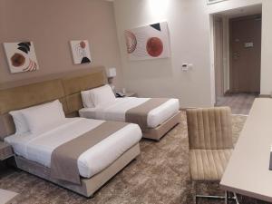 Uma área de estar em Gloria Hotel & Suites Doha