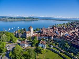 an aerial view of a town on a lake at Stellamandra in Murten