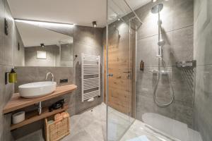 a bathroom with a shower and a sink and a shower at Miramonte in Sölden +77 photos