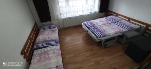 Posteľ alebo postele v izbe v ubytovaní Privat L&L