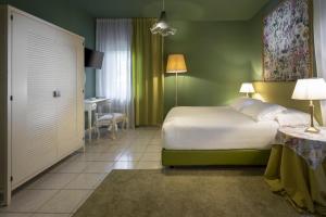 Postel nebo postele na pokoji v ubytování B&B Maison Biagetti