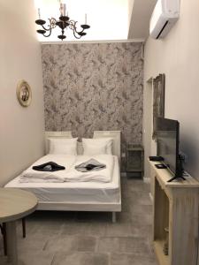 Posteľ alebo postele v izbe v ubytovaní All In Apartman IV.