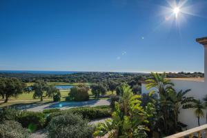 a view from the balcony of a resort with a river and trees at Inmood San Roque in Sotogrande