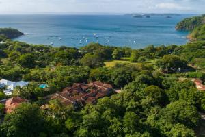 an aerial view of a house and the ocean at The Cove at Playa Ocotal in Coco