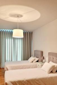 Un pat sau paturi într-o cameră la Ocean Pearl Apartment V