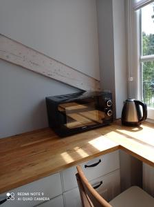 a toaster oven sitting on a counter in a kitchen at Dolce in Duszniki Zdrój