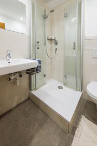 a bathroom with a shower and a sink at Haus Dippel in Ruhpolding