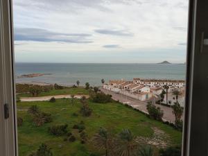 a view of the ocean from a room with a window at OceanView Apartment in La Manga del Mar Menor