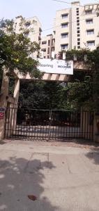 a gate with a sign in front of a building at Brookside Service Apartment in Bangalore