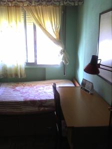 Ένα ή περισσότερα κρεβάτια σε δωμάτιο στο HAB room 1 WIFI Vista Alegre