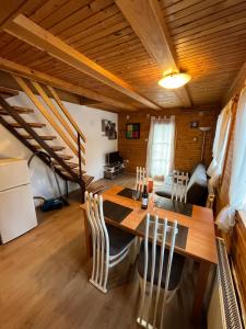 a kitchen and dining room with a table and chairs at Apartments Jelka in Kranjska Gora