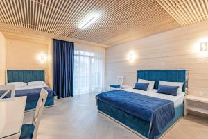 Postel nebo postele na pokoji v ubytování Milana SPA & Hotel - SPA included