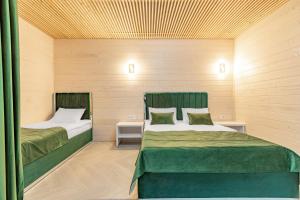 Postel nebo postele na pokoji v ubytování Milana SPA & Hotel - SPA included