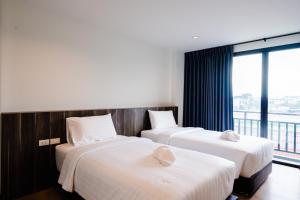 Postel nebo postele na pokoji v ubytování JS HOTEL