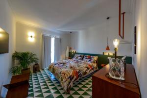 a bedroom with a bed and a table in a room at B&B Toledo Panoramic Rooftop with terrace in Naples