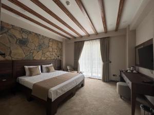 Postel nebo postele na pokoji v ubytování Pinhan Otel Kazdağıları