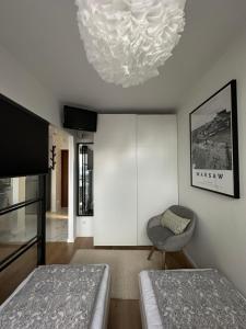 Posteľ alebo postele v izbe v ubytovaní Apartament Warszawa Centrum Śródmieście