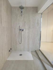 a bathroom with a shower with a shower head at Luxury Tower House in heart of Pisa in Pisa