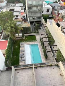 an overhead view of a swimming pool in a building at Metropolitan Highline Apartments in Buenos Aires