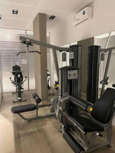 a gym with a treadmill and a exercise bike at Metropolitan Highline Apartments in Buenos Aires