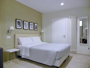 Postel nebo postele na pokoji v ubytování L'OSPITE - LIFESTYLE RESIDENCE, Design Rooms