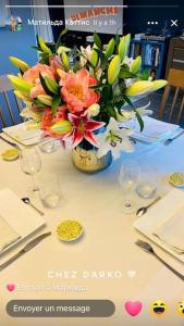 a vase of flowers sitting on top of a table at Belle appartement T3 pour 5 personne max in Annecy