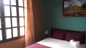 Rúm í herbergi á HOTEL EL ALMENDRO