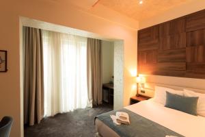 Postel nebo postele na pokoji v ubytování Hotel Elements + 37 fotografií