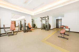a gym with treadmills and machines in a room at Maison Privee - Superb 1BR apartment overlooking Zabeel Park and Dubai Frame in Dubai
