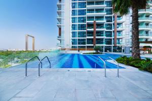 a swimming pool in the middle of a building at Maison Privee - Superb 1BR apartment overlooking Zabeel Park and Dubai Frame in Dubai