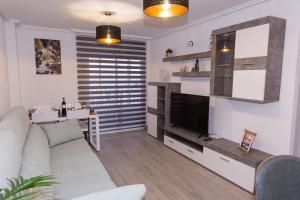 TV a/nebo společenská místnost v ubytování vistas al mar