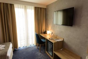 Telewizja i/lub zestaw kina domowego w obiekcie Hotel Elements
