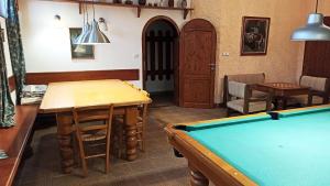 a living room with a pool table in it at Penzion Vanda in Velké Pavlovice