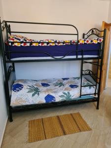 Bunk bed o mga bunk bed sa kuwarto sa Perle d'Aftas