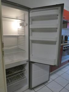 a refrigerator with its doors open in a kitchen at Ferienwohnung Wanderparadies Neuwied-Heimbach in Neuwied